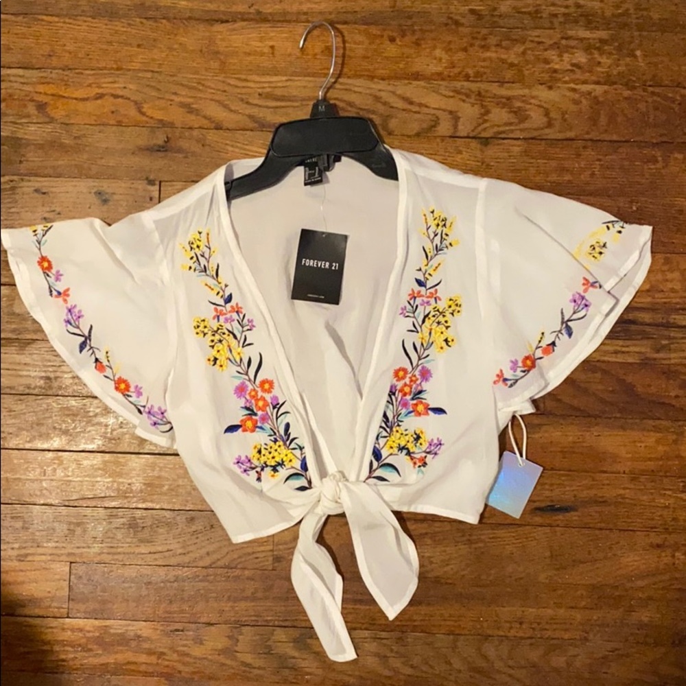 Tie front blouse with flower embroidery.